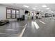 Bright fitness room featuring hardwood floors, mirrors, and ample open space at 99 Vivante Blvd # 303, Punta Gorda, FL 33950