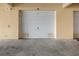 This garage offers a neutral-colored exterior, and a white garage door at 99 Vivante Blvd # 303, Punta Gorda, FL 33950
