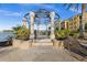 Picturesque gazebo overlooking the water, offering a serene spot to relax and enjoy the scenic views at 99 Vivante Blvd # 303, Punta Gorda, FL 33950