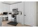 Eat-in kitchen featuring white cabinets and stainless steel appliances at 99 Vivante Blvd # 303, Punta Gorda, FL 33950