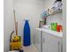Efficient laundry room with washer, dryer, and ample space for storage and cleaning supplies at 99 Vivante Blvd # 303, Punta Gorda, FL 33950