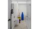 Compact laundry room efficiently equipped with storage and essential cleaning equipment at 99 Vivante Blvd # 303, Punta Gorda, FL 33950
