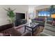 Comfortable living room features contemporary decor and a view to the outside through sliding glass doors at 99 Vivante Blvd # 303, Punta Gorda, FL 33950