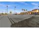 Well-maintained tennis court with palm trees in the background, perfect for active residents to enjoy at 99 Vivante Blvd # 303, Punta Gorda, FL 33950