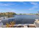 Expansive water view from this community showcasing the community buildings and waterfront lifestyle at 99 Vivante Blvd # 303, Punta Gorda, FL 33950