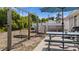 Relaxing backyard with above ground pool, picnic table, and swing set at 10229 Gulfstream Blvd, Englewood, FL 34224