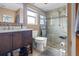 Well-lit bathroom features a glass-enclosed shower, sleek vanity, and modern fixtures at 10229 Gulfstream Blvd, Englewood, FL 34224