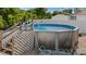 This image showcases a refreshing above-ground pool surrounded by lush greenery, perfect for relaxation and outdoor enjoyment at 10229 Gulfstream Blvd, Englewood, FL 34224