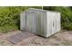 Functional outdoor shed with a ramp offering additional storage space for tools and equipment at 10229 Gulfstream Blvd, Englewood, FL 34224