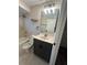 Full bathroom with tub, shower, and gray vanity at 11422 2Nd Ave, Punta Gorda, FL 33955