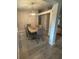 Features a spacious dining area with a wooden table, seating for six, a decorative rug, and modern chandelier at 11422 2Nd Ave, Punta Gorda, FL 33955