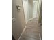 Hallway with wood floors and neutral paint at 11422 2Nd Ave, Punta Gorda, FL 33955