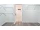 Empty closet featuring gray flooring, white walls, and adjustable metal shelving at 1231 Beacon Dr, Port Charlotte, FL 33952