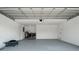 Spacious garage with laundry area, utility sink, and plenty of room for storage and parking at 1231 Beacon Dr, Port Charlotte, FL 33952