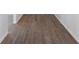 Empty hallway featuring gray flooring, white baseboards, and white walls at 1231 Beacon Dr, Port Charlotte, FL 33952