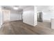 Open-concept living space with modern gray floors and a view towards the updated kitchen at 1231 Beacon Dr, Port Charlotte, FL 33952