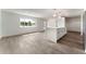 Bright living room with large windows, stylish flooring, and a breakfast bar with elegant pendant lights at 1231 Beacon Dr, Port Charlotte, FL 33952