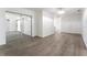Bright living room with sliding glass doors and gray wood floors at 1231 Beacon Dr, Port Charlotte, FL 33952
