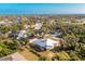 Single-Gathering home with screened lanai, surrounded by mature trees in a waterfront community at 13204 Kakapo Ave, Port Charlotte, FL 33981