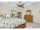 Bright bedroom with a tropical-themed bed, wood floors, and traditional furniture at 13204 Kakapo Ave, Port Charlotte, FL 33981
