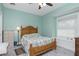 Cozy bedroom with a ceiling fan, a window seat, and lots of natural light at 13204 Kakapo Ave, Port Charlotte, FL 33981