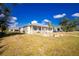Charming home with manicured lawn and large boulders in the front yard at 13204 Kakapo Ave, Port Charlotte, FL 33981