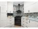 Compact kitchen area featuring stainless steel appliances and ample cabinet space at 13204 Kakapo Ave, Port Charlotte, FL 33981