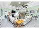 Inviting living room with fireplace, comfortable seating, and seamless access to the dining area at 13204 Kakapo Ave, Port Charlotte, FL 33981