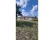 Expansive backyard featuring a patio and green space, ideal for outdoor gatherings and relaxation at 13366 Ballon Ave, Port Charlotte, FL 33981
