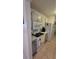 Functional kitchen with white appliances, generous countertop area, and sufficient storage solutions for culinary needs at 13366 Ballon Ave, Port Charlotte, FL 33981
