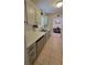Well-organized kitchen with stainless steel appliances, marble countertops, and ample cabinet space at 13366 Ballon Ave, Port Charlotte, FL 33981