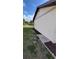 Landscaped side yard with stone and mulch accents along the home's exterior, adding to its curb appeal at 13366 Ballon Ave, Port Charlotte, FL 33981