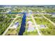 Aerial view of a waterfront community with stunning canal views and private docks at 13830 Begonia Cir, Port Charlotte, FL 33981