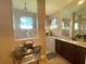 Bright bathroom with dual sinks, granite countertops, and decorative flower arrangement at 13830 Begonia Cir, Port Charlotte, FL 33981