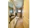 Bathroom featuring a granite countertop vanity and an elegant glass-enclosed shower at 13830 Begonia Cir, Port Charlotte, FL 33981