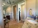 Neutral bathroom with vanity, toilet, and multiple doorways to other rooms at 13830 Begonia Cir, Port Charlotte, FL 33981