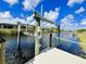 Dock with a boat lift for easy access to the water at 13830 Begonia Cir, Port Charlotte, FL 33981