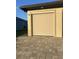 Garage door with sun shade and brick-paved driveway for added appeal at 13830 Begonia Cir, Port Charlotte, FL 33981