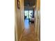 Hallway with tile floors that leads to main bedroom that has access to the lanai at 13830 Begonia Cir, Port Charlotte, FL 33981
