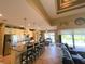 Open kitchen featuring a center island, stainless appliances, granite countertops, and a tiled backsplash at 13830 Begonia Cir, Port Charlotte, FL 33981