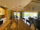 Granite kitchen island overlooks screened lanai with pool in this open floorplan at 13830 Begonia Cir, Port Charlotte, FL 33981