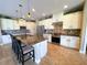 Bright kitchen features granite countertops, stainless steel appliances, tile backsplash and an island with bar seating at 13830 Begonia Cir, Port Charlotte, FL 33981