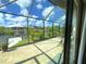 Enclosed lanai featuring a beautiful view of the water and neighboring homes at 13830 Begonia Cir, Port Charlotte, FL 33981