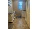 Functional laundry room with stacked washer/dryer and storage, plus ample light at 13830 Begonia Cir, Port Charlotte, FL 33981