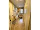 Convenient laundry room with white cabinets, countertop, and a stacked washer/dryer at 13830 Begonia Cir, Port Charlotte, FL 33981
