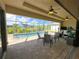Screened-in lanai with a dining area and a view of the private pool at 13830 Begonia Cir, Port Charlotte, FL 33981