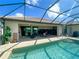 Spacious pool area with an outdoor kitchen and dining area and a private in-ground pool at 13830 Begonia Cir, Port Charlotte, FL 33981