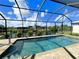 Large screened-in pool featuring scenic views of the surrounding waterway at 13830 Begonia Cir, Port Charlotte, FL 33981
