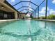 Private screened-in pool area with crystal-clear water and relaxing views at 13830 Begonia Cir, Port Charlotte, FL 33981