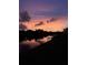 Stunning canal view at sunset, featuring colorful skies reflecting on the calm water at 13830 Begonia Cir, Port Charlotte, FL 33981